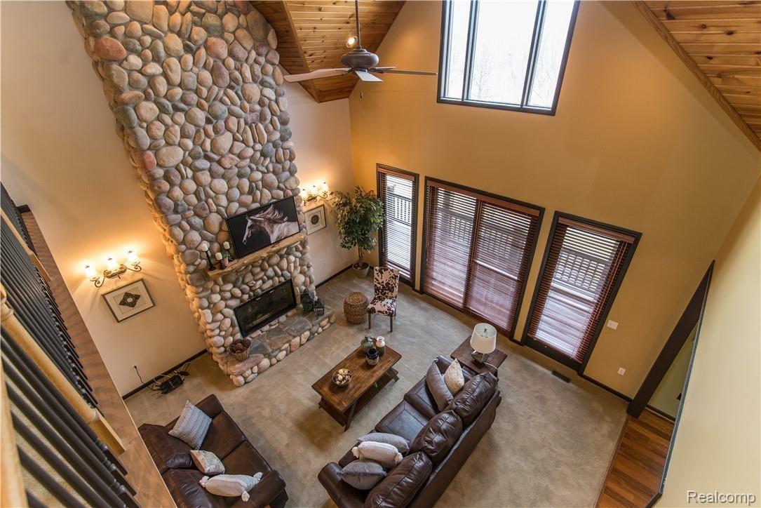 4760 Winding Way Howell, MI 48843 - Photo 34 of 59 Great Room. Tons of Natural Lighting & Incredible Views.