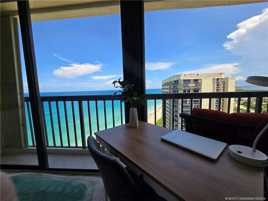 9500 South Ocean Drive, Unit 1908 Jensen Beach, FL 34957 - Photo 13 of 25 a view of a balcony with two chairs