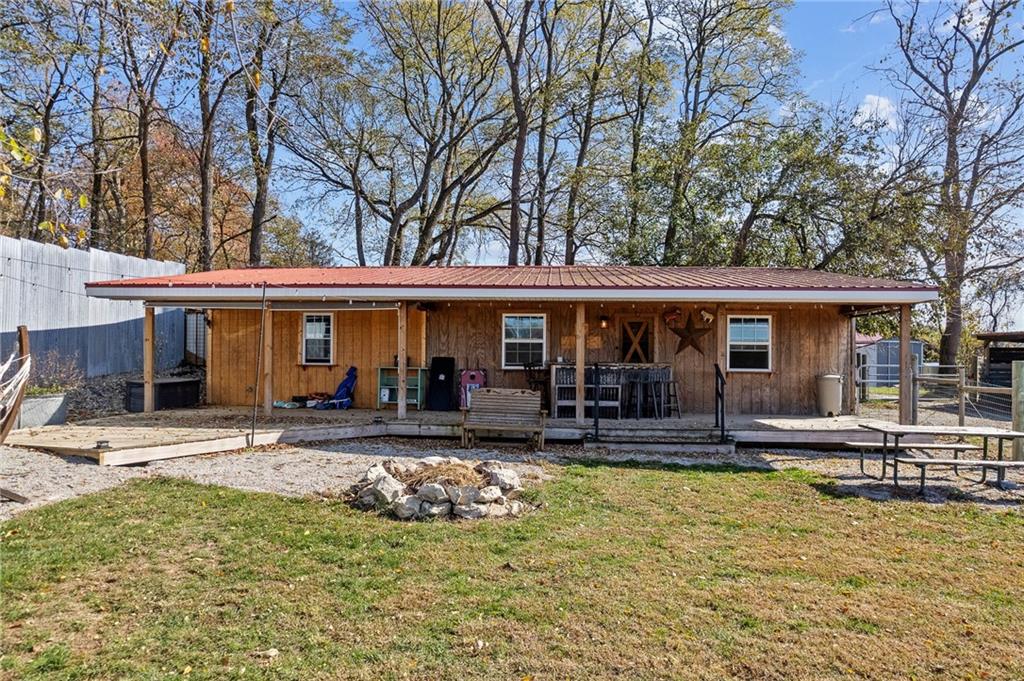 1060 Sugar Run Road Finleyville, PA 15332 - Photo 32 of 50 Fenced in and equipped w/outdoor kitchen, fire pit, covered deck w/bar, 3 horse stalls and room able to convert to a 4th stall!