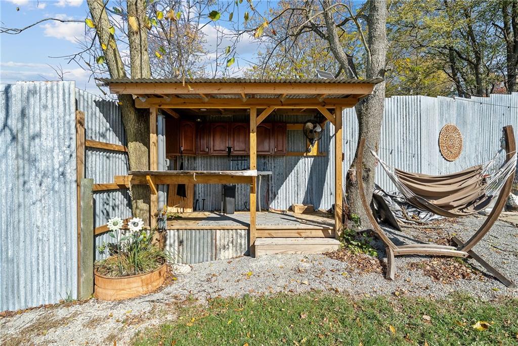 1060 Sugar Run Road Finleyville, PA 15332 - Photo 35 of 50 Fenced in and equipped w/outdoor kitchen, fire pit, covered deck w/bar, 3 horse stalls and room able to convert to a 4th stall!
