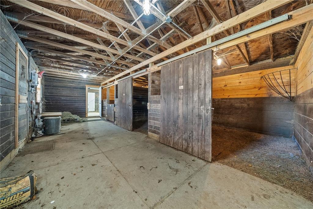 1060 Sugar Run Road Finleyville, PA 15332 - Photo 36 of 50 Fenced in and equipped w/outdoor kitchen, fire pit, covered deck w/bar, 3 horse stalls and room able to convert to a 4th stall!