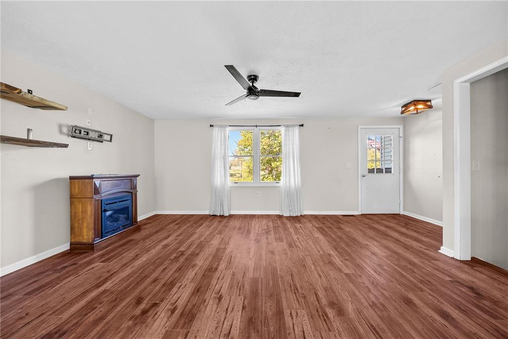 1060 Sugar Run Road Finleyville, PA 15332 - Photo 6 of 50 Open concept living room pours into dining area and kitchen.