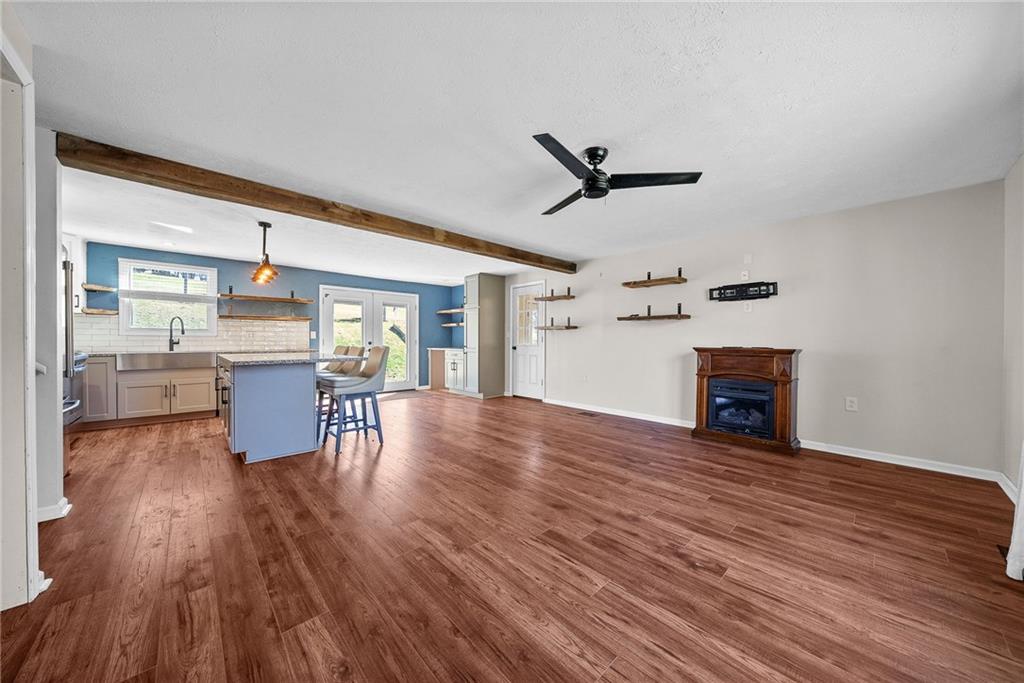 1060 Sugar Run Road Finleyville, PA 15332 - Photo 8 of 50 Open concept living room pours into dining area and kitchen.