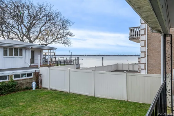 a view of a house with a sink and a yard