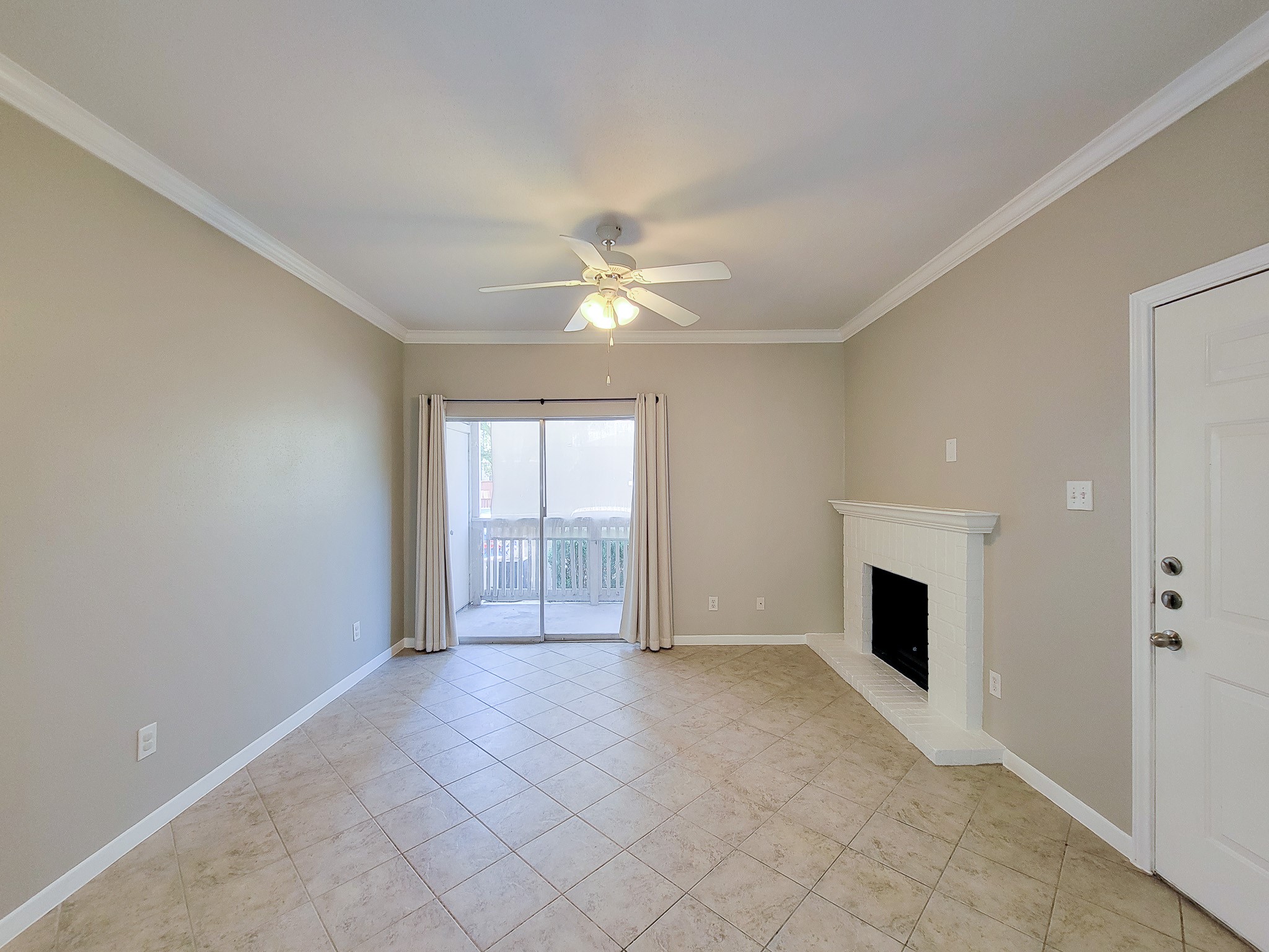 4041 Drake Street, Unit 116 Houston, TX 77005 - Photo 14 of 27 a view of an empty room with a fireplace