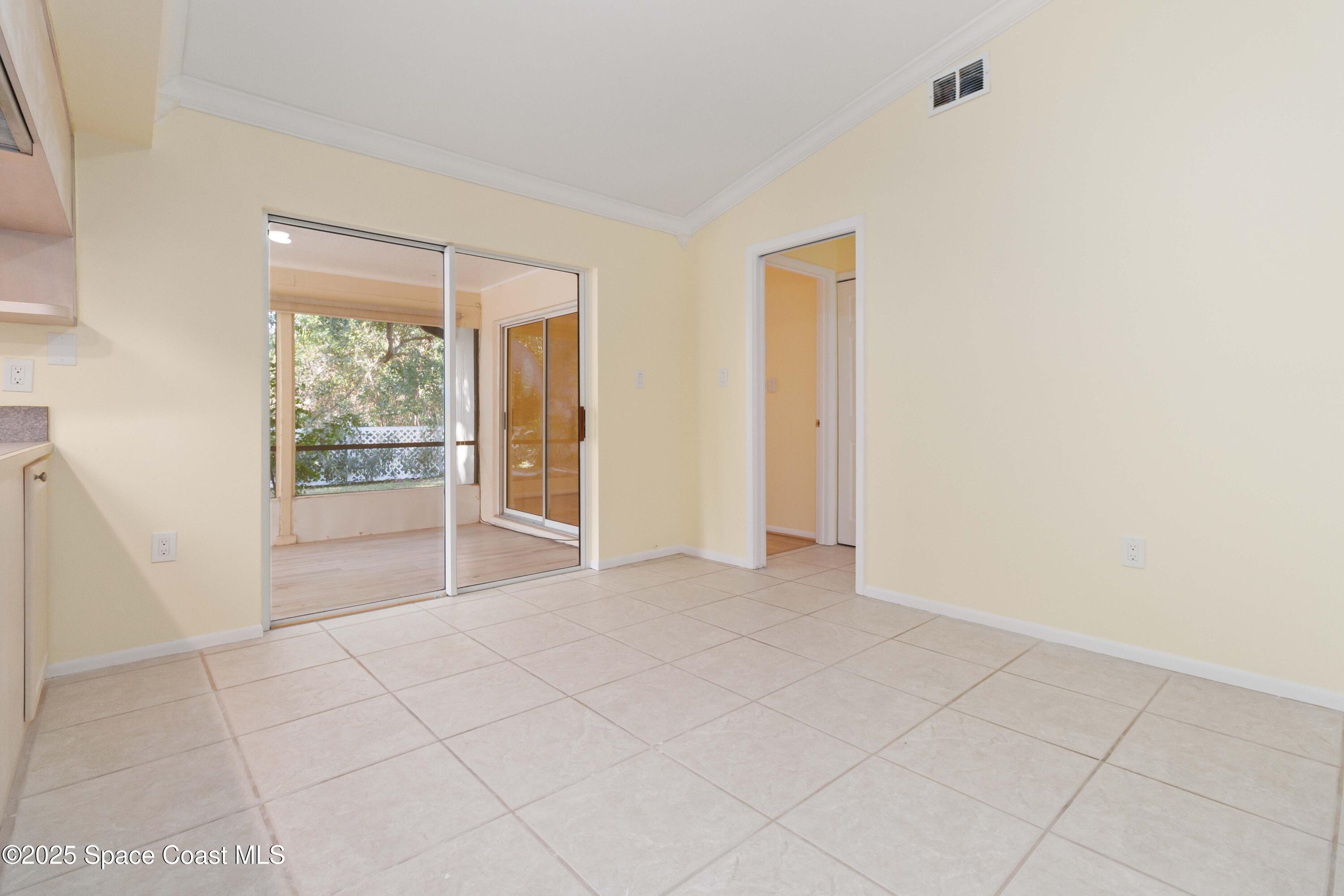 2355 Raintree Lake Circle Merritt Island, FL 32953 - Photo 20 of 47 a view of an empty room with glass door