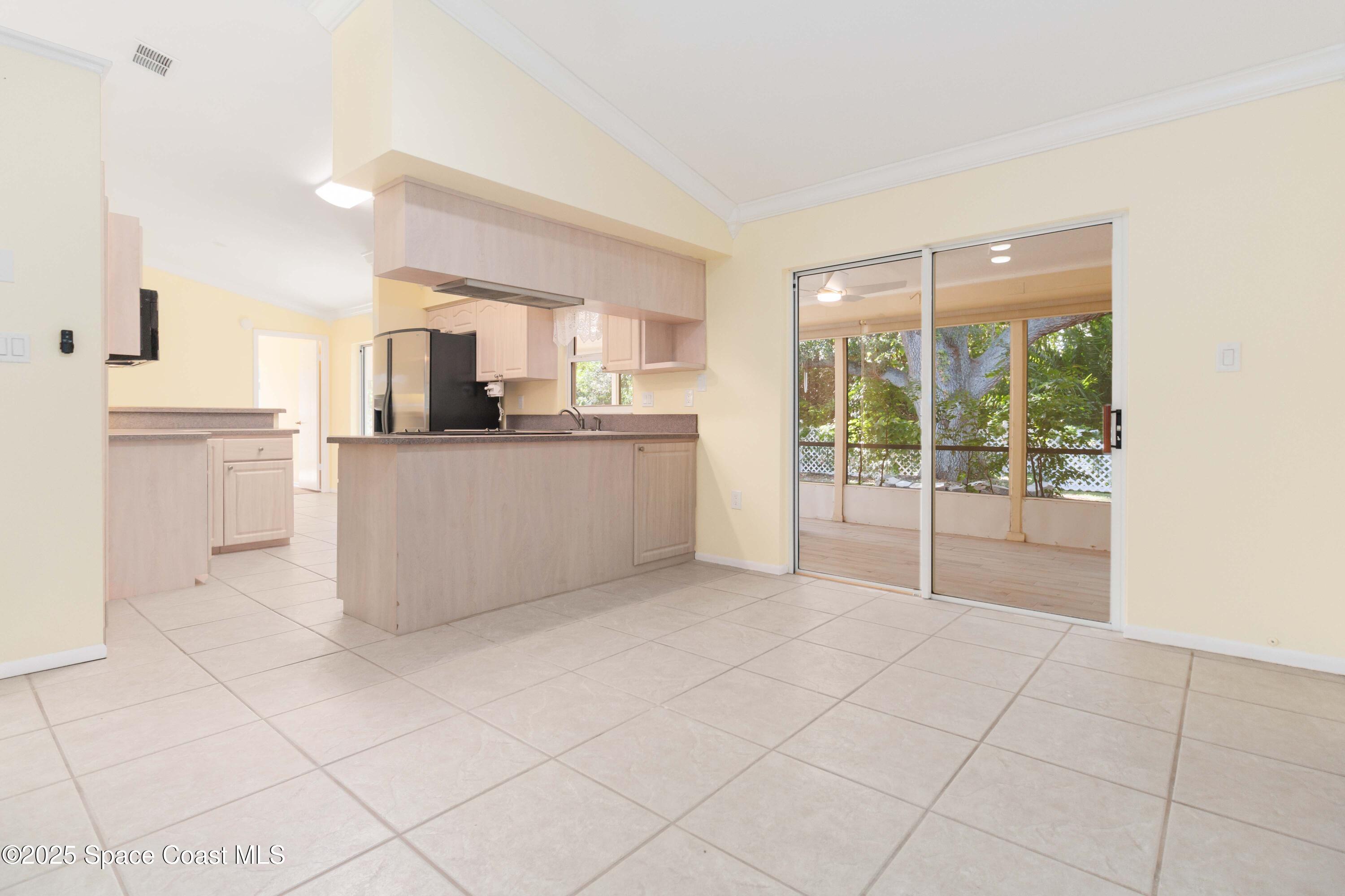2355 Raintree Lake Circle Merritt Island, FL 32953 - Photo 22 of 47 a large white kitchen with white cabinets and stainless steel appliances