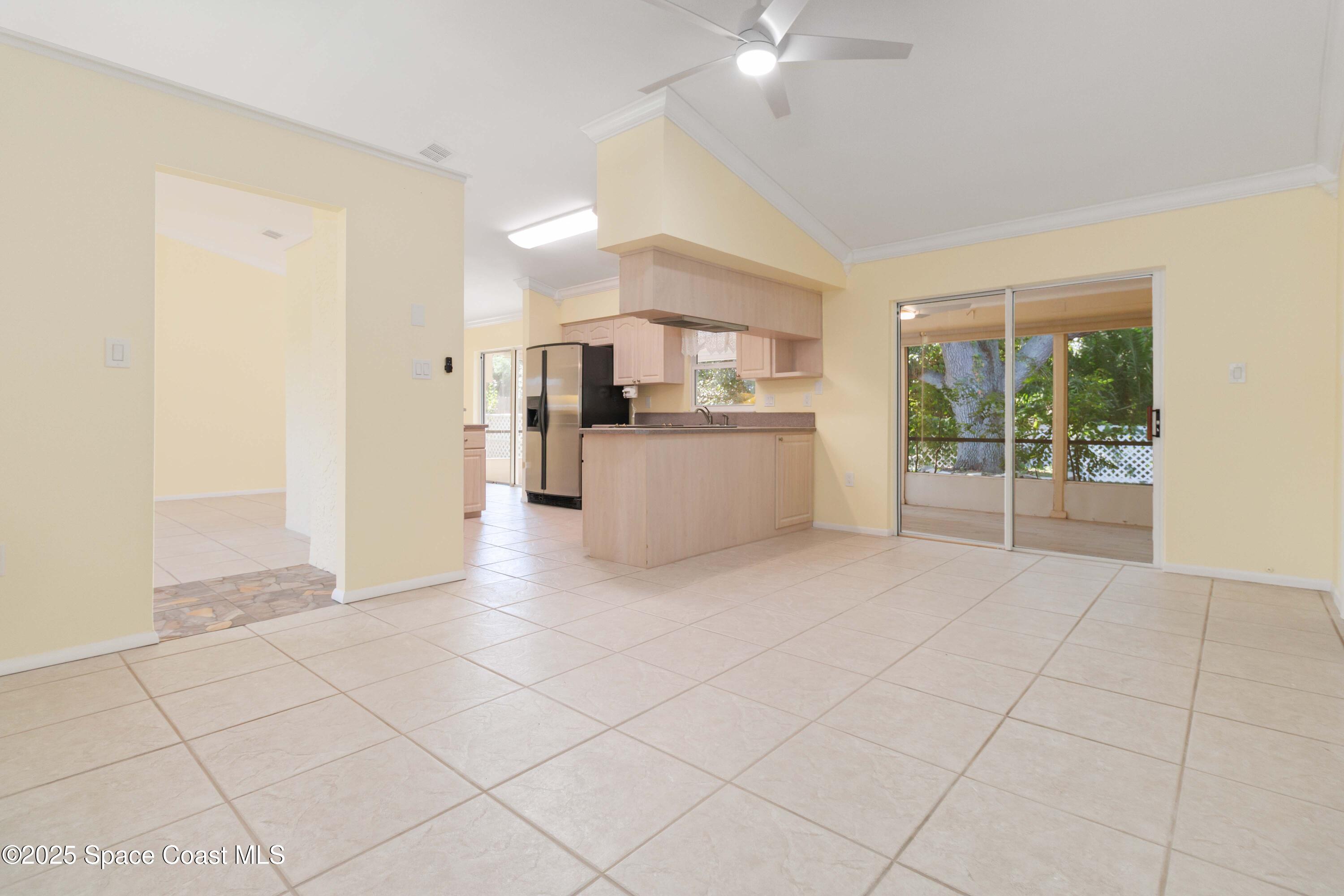 2355 Raintree Lake Circle Merritt Island, FL 32953 - Photo 23 of 47 a view of a kitchen with furniture and an empty room