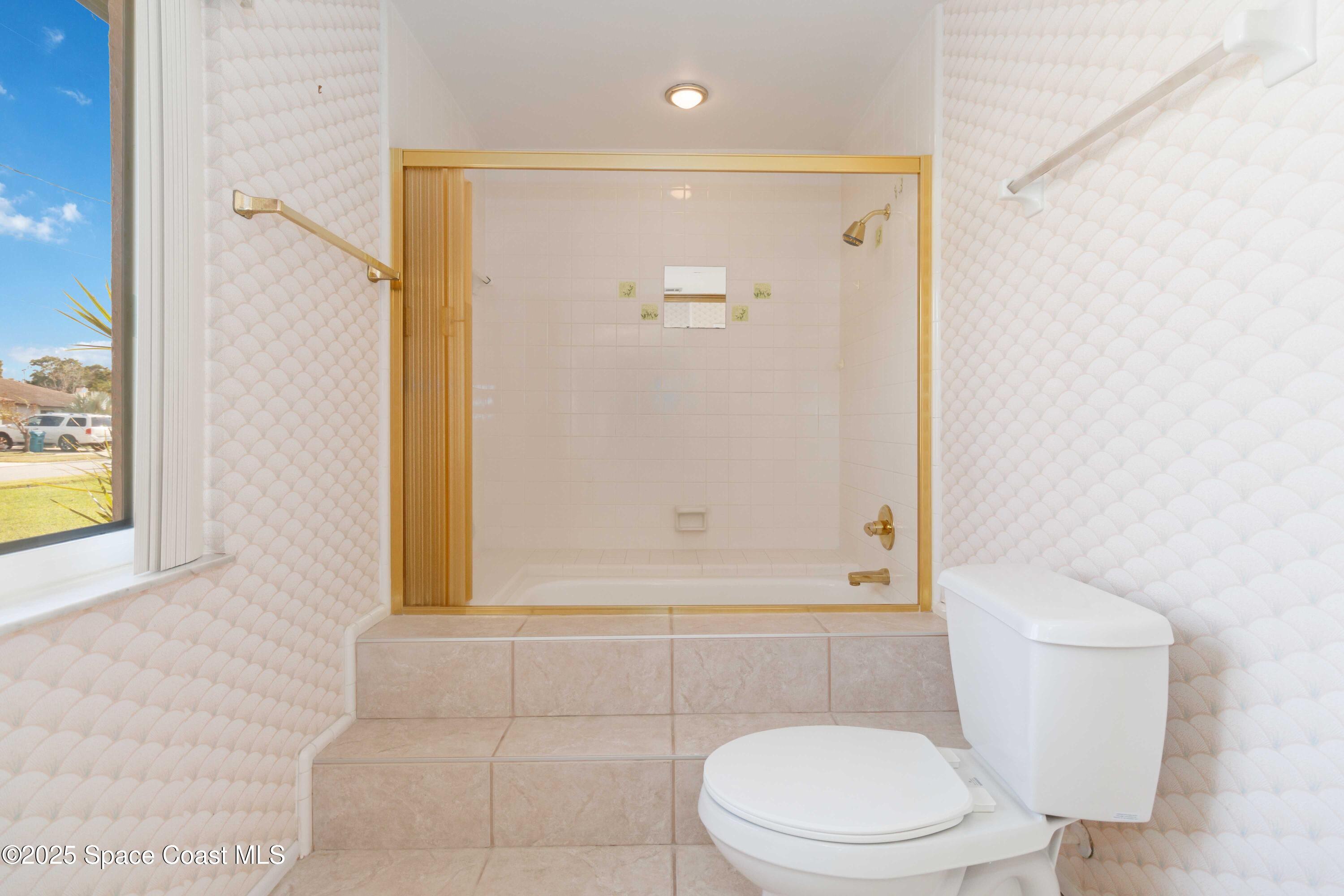 2355 Raintree Lake Circle Merritt Island, FL 32953 - Photo 34 of 47 a bathroom with a toilet and a shower