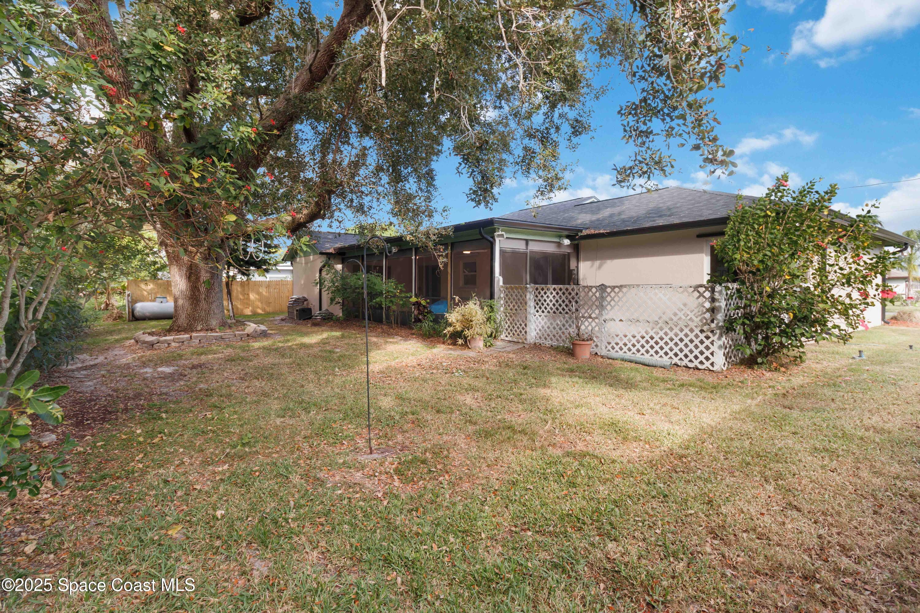 2355 Raintree Lake Circle Merritt Island, FL 32953 - Photo 41 of 47 a view of a house with a tree