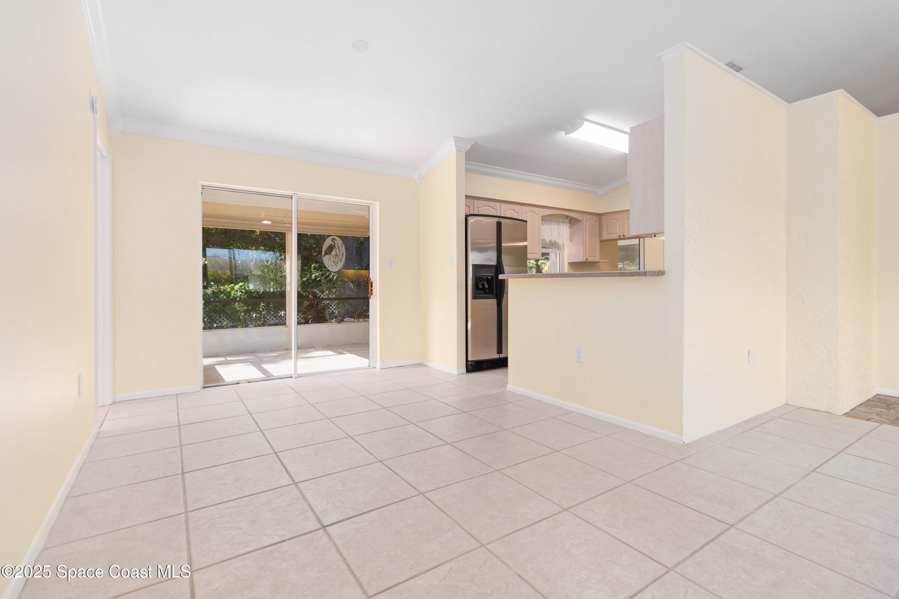 2355 Raintree Lake Circle Merritt Island, FL 32953 - Photo 10 of 47 a view of a kitchen with a sink and a refrigerator