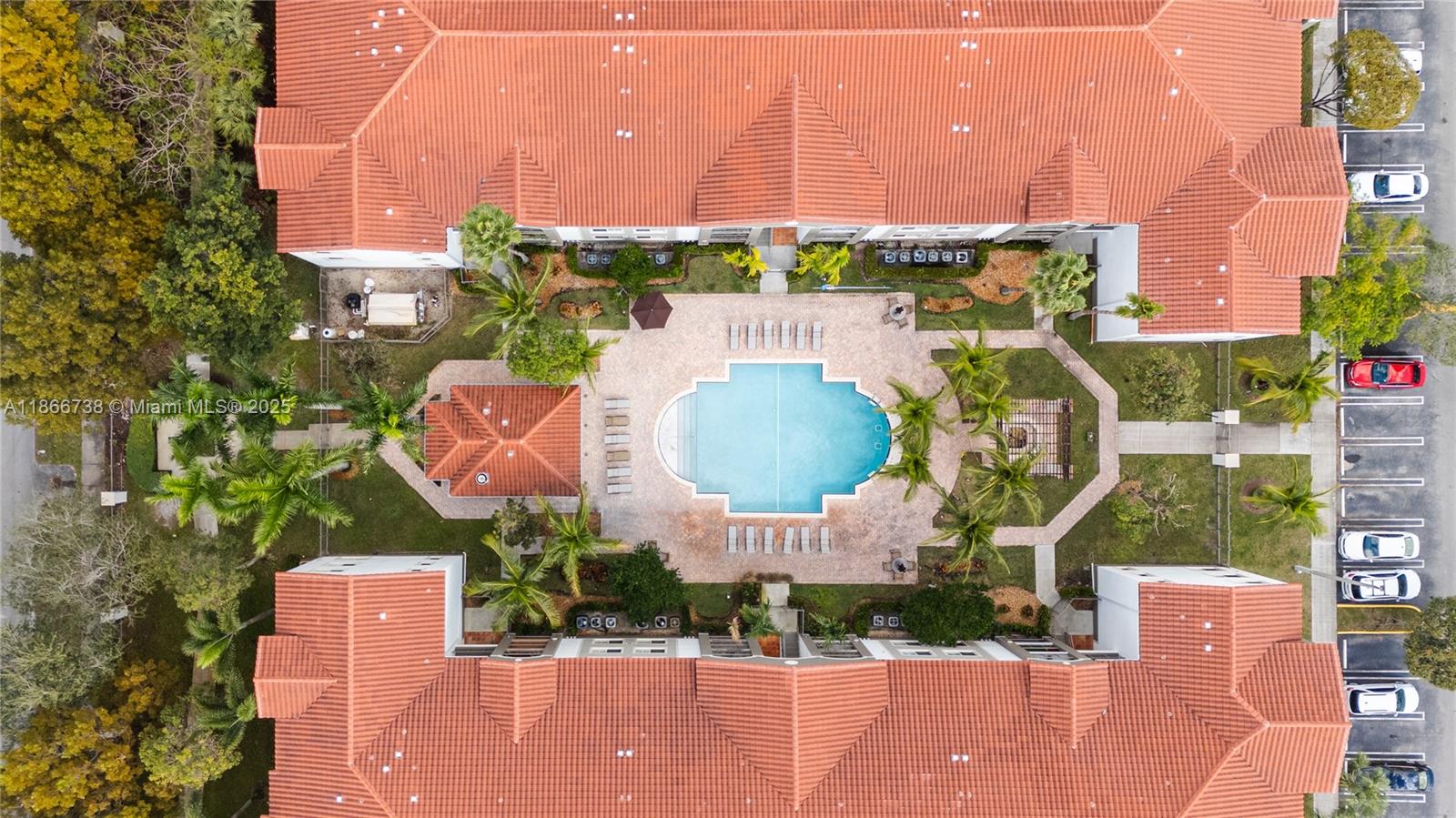 6851 Southwest 44th Street, Unit 106 Miami, FL 33155 - Photo 4 of 17 an aerial view of a house with a garden and outdoor seating