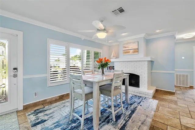 a room with stainless steel appliances kitchen island granite countertop furniture and a kitchen view
