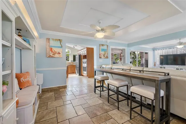 a kitchen with stainless steel appliances granite countertop a sink and a refrigerator