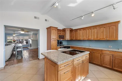 a kitchen that has a sink a oven and a table in it