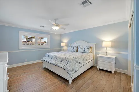 a bedroom with a large bed and a window