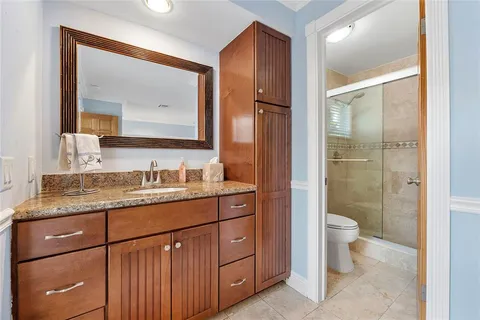 a bathroom with a shower and a toilet