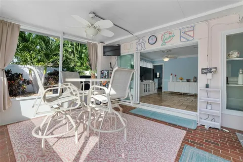 a view of a swimming pool with a patio and a yard