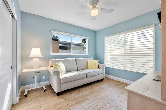 a view of a swimming pool with lounge chairs