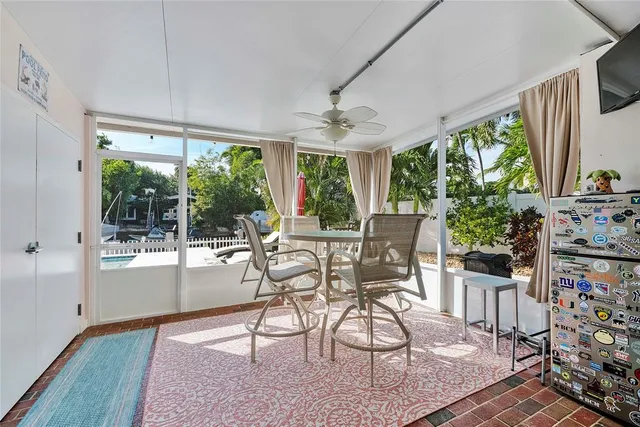 a view of a patio with a table and chairs under an umbrella