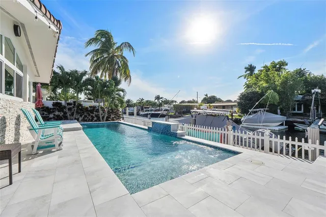 a view of a swimming pool with a patio