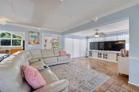 a living room with furniture and white walls