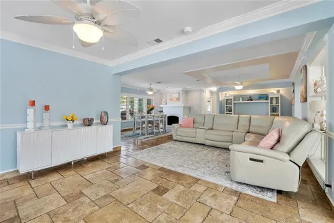 a living room with furniture a fireplace and a table
