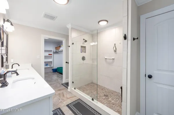 a bathroom with a sink and a shower