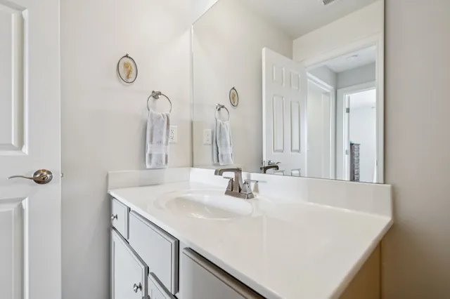 a bathroom with a shower curtain and a bathtub