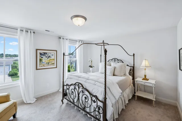 a bathroom with a sink a toilet a tub and shower