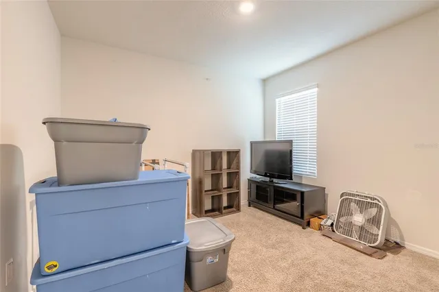 a living room with a couch and a flat screen tv