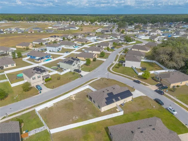 a view of a swimming pool with a yard