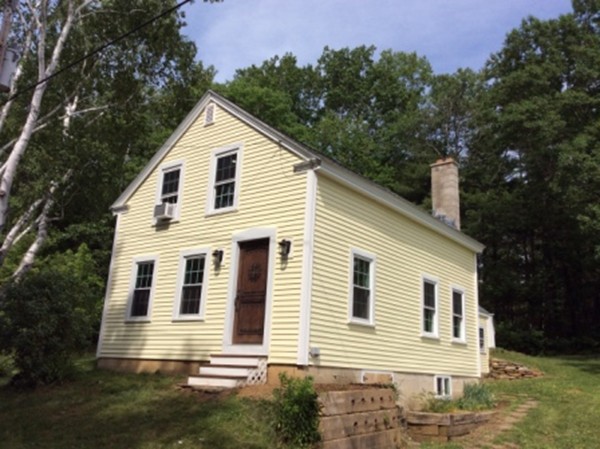 840 W Road New Braintree, MA 01531 - Photo 1 of 30 a front view of a house with a yard