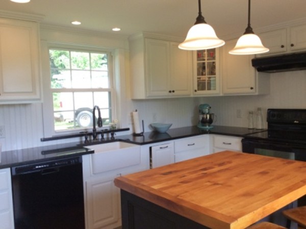 840 W Road New Braintree, MA 01531 - Photo 12 of 30 a kitchen with stainless steel appliances granite countertop a sink a stove a counter space and cabinets