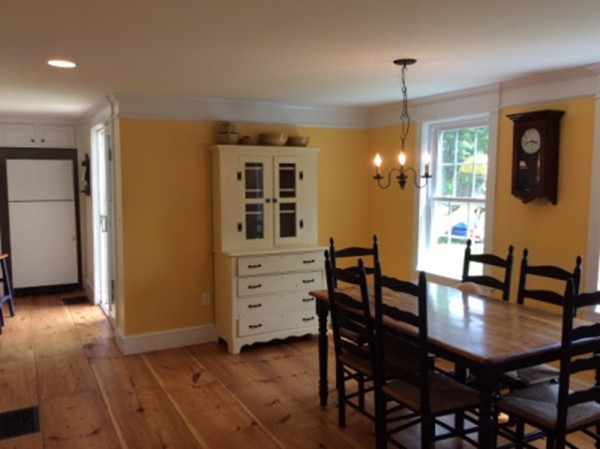 840 W Road New Braintree, MA 01531 - Photo 14 of 30 a view of a dining room with furniture and wooden floor