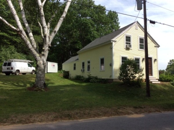 840 W Road New Braintree, MA 01531 - Photo 2 of 30 a front view of a house with a yard