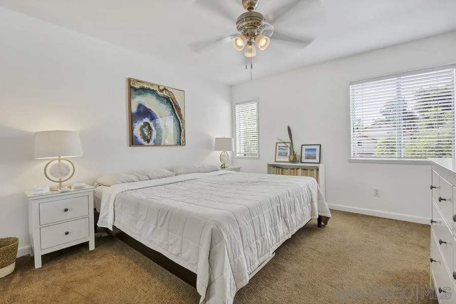1758 Edgefield Lane Encinitas, CA 92024 - Photo 16 of 25 a bedroom with a large bed and a window