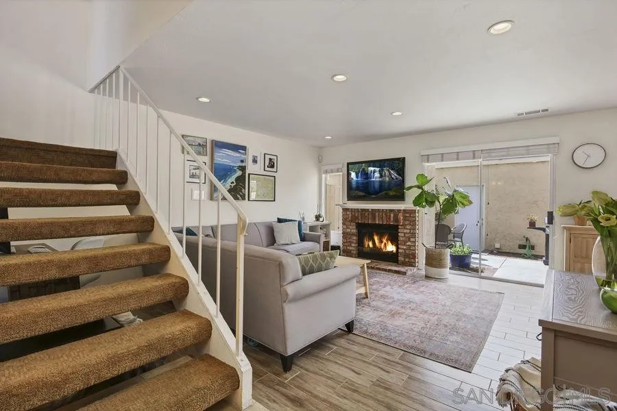 1758 Edgefield Lane Encinitas, CA 92024 - Photo 3 of 25 a living room with furniture and a fireplace