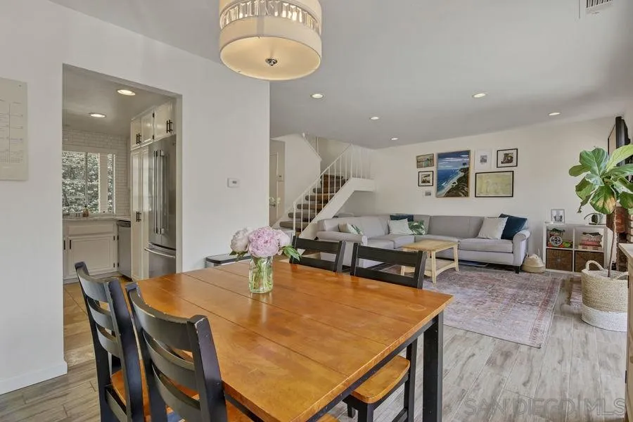 1758 Edgefield Lane Encinitas, CA 92024 - Photo 5 of 25 a view of a dining room with furniture and wooden floor