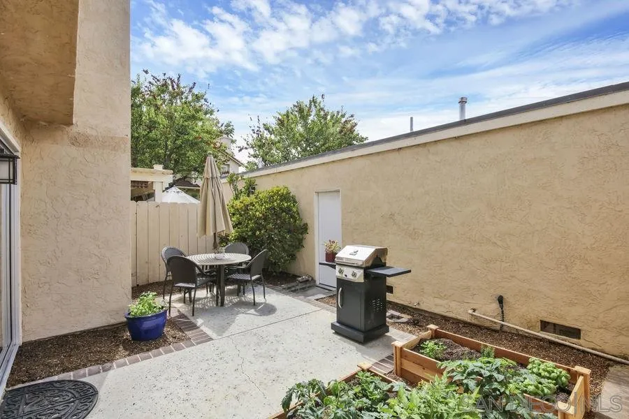 1758 Edgefield Lane Encinitas, CA 92024 - Photo 9 of 25 a view of a chairs and table in backyard
