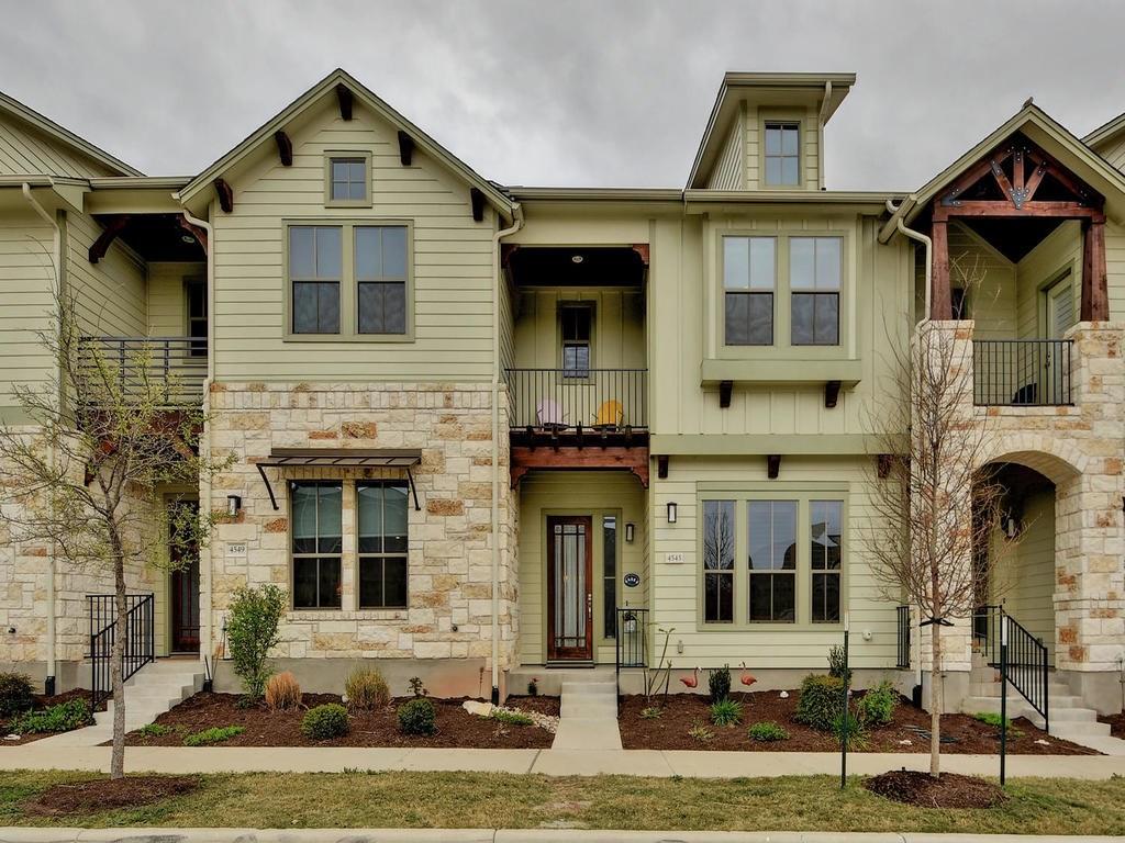 4545 Mattie Street Austin, TX 78723 - Photo 1 of 28 a front view of a house with a yard