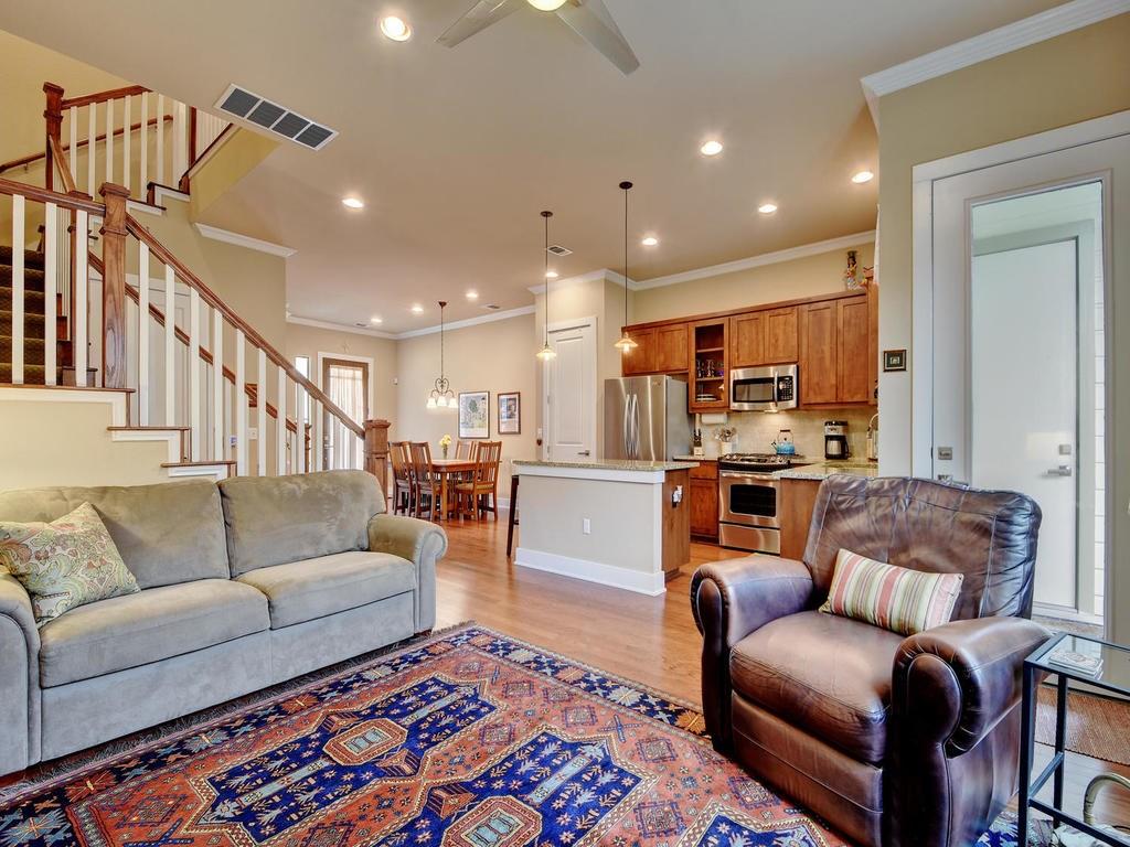 4545 Mattie Street Austin, TX 78723 - Photo 13 of 28 a living room with furniture and a view of kitchen