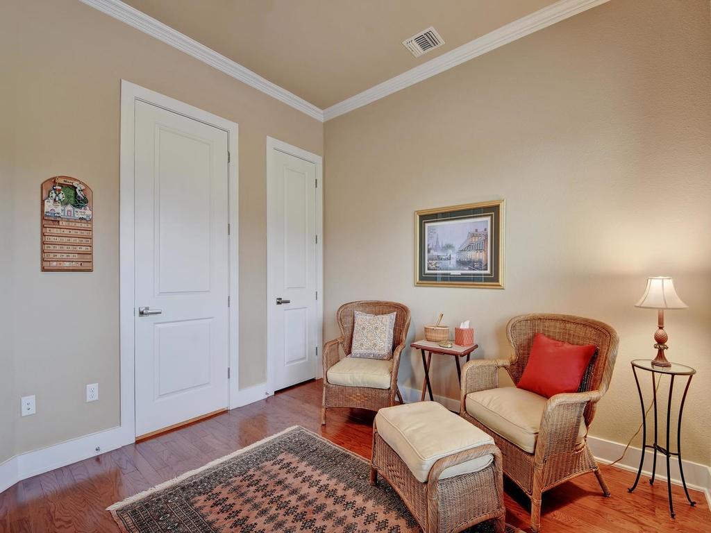 4545 Mattie Street Austin, TX 78723 - Photo 16 of 28 a living room with furniture and a lamp with wooden floor