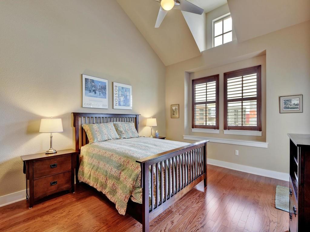 4545 Mattie Street Austin, TX 78723 - Photo 17 of 28 a bedroom with a bed and a window