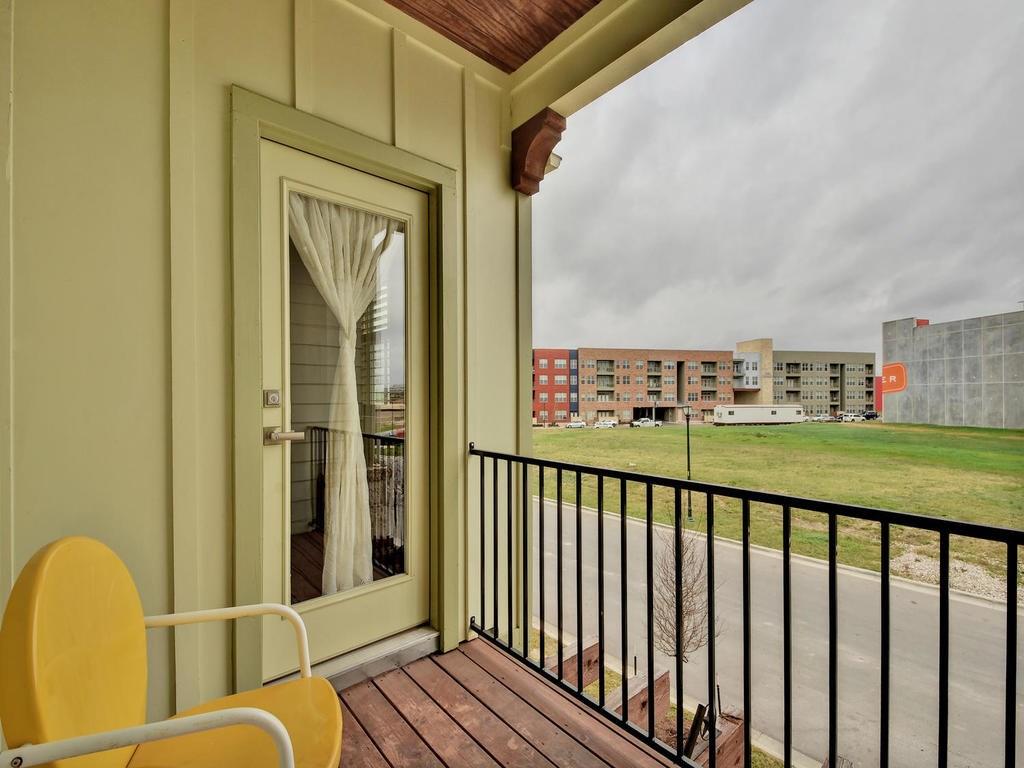 4545 Mattie Street Austin, TX 78723 - Photo 19 of 28 a view of a balcony with wooden floor