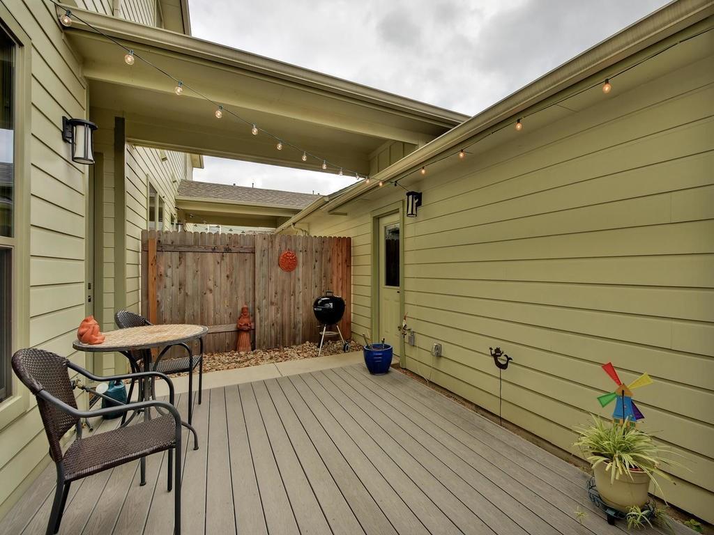 4545 Mattie Street Austin, TX 78723 - Photo 27 of 28 a patio with table and chairs and potted plants