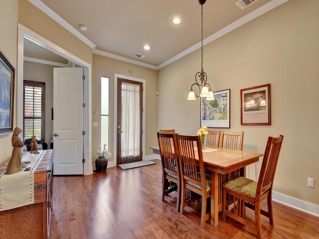 4545 Mattie Street Austin, TX 78723 - Photo 3 of 28 a view of a dining room with furniture window and wooden floor
