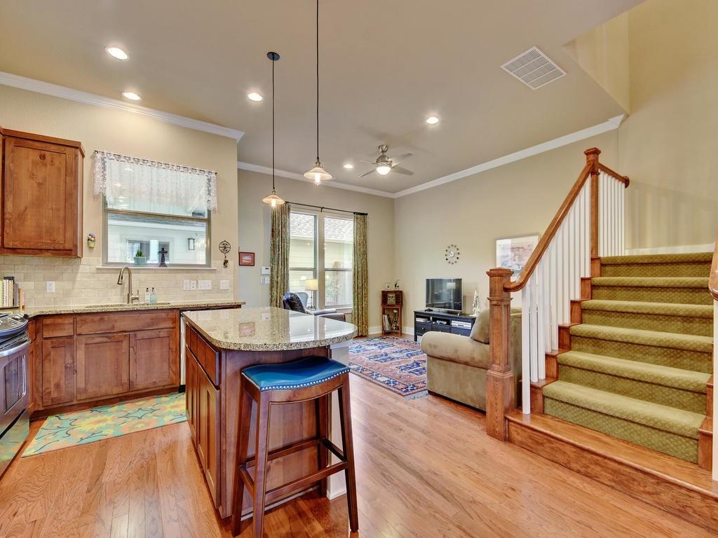 4545 Mattie Street Austin, TX 78723 - Photo 5 of 28 a kitchen with sink cabinets and wooden floor