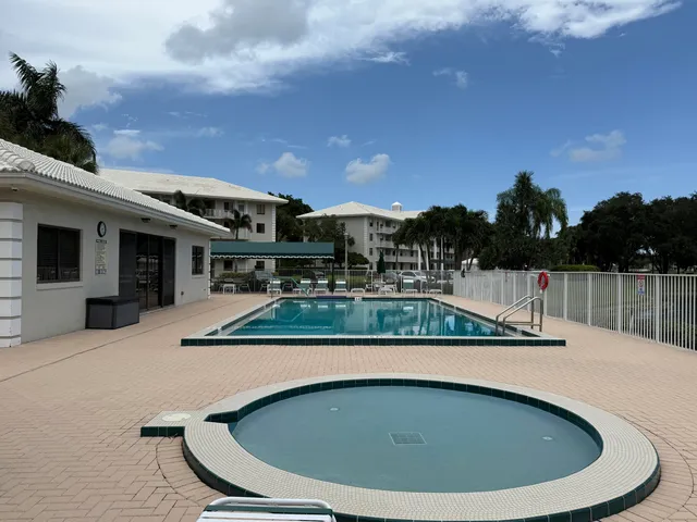 a view of a swimming pool with a patio