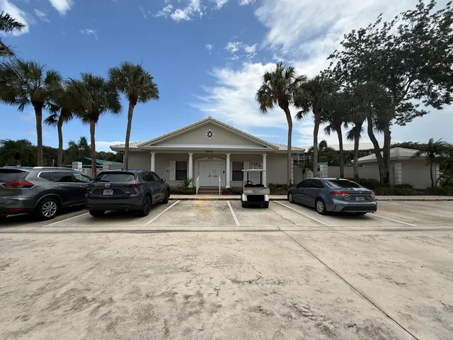 a view of a car parked in front of house